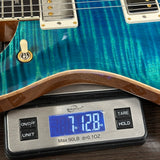PRS Select Wood Library McCarty 594 Trem 10 Top Laguna on scale displaying weight.