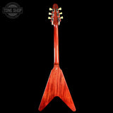 A glossy reddish-brown wooden double-sided guitar headstock and body, shown vertically against a solid black background. A circular 'TONE SHOP' watermark is visible in the top-left corner.