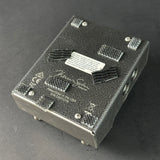 Electronic device with visible branding on a dark background