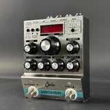 Guitar effects pedal with various controls on a gray background