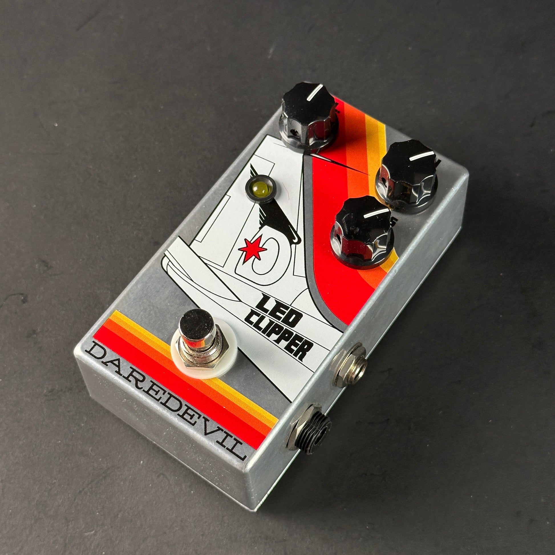 Guitar effects pedal with 'Led Clipper' and 'Daredevil' branding on a dark background