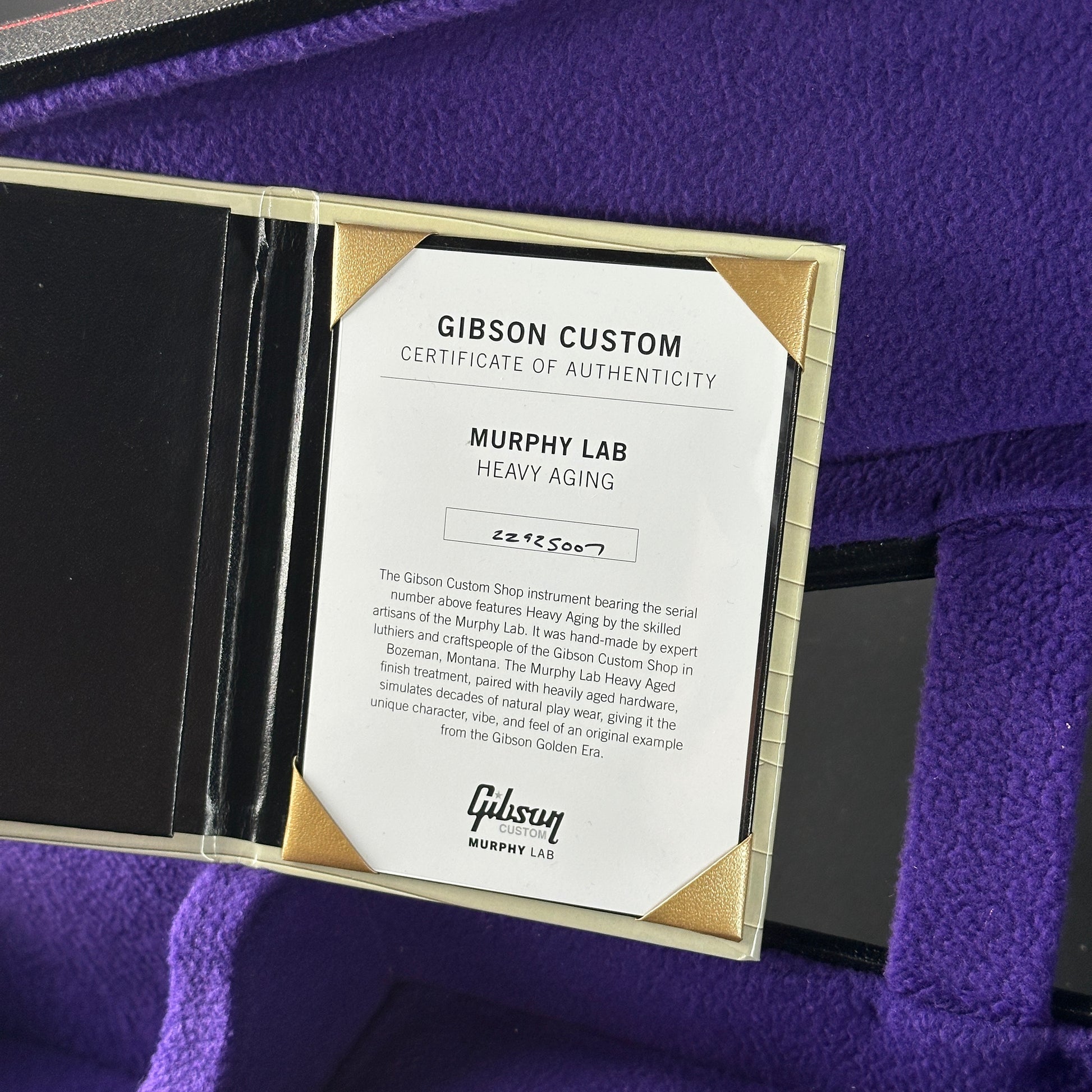 Gibson Custom Certificate of Authenticity on a purple surface