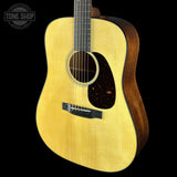 A close-up studio shot of an acoustic guitar against a solid black background, featuring a natural flamed maple top, dark wood sides, and a black pickguard. A Tone Shop watermark is visible in the top-left corner.