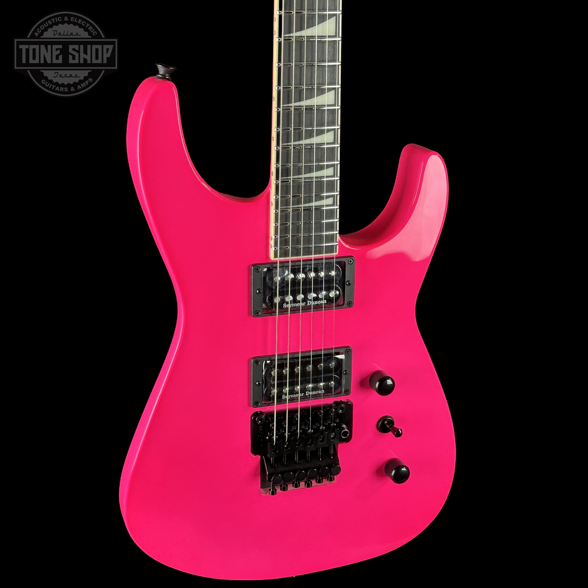 Front left angle of Jackson Custom Shop TSG Illuminati SL2H FR  Neon Pink J11328.