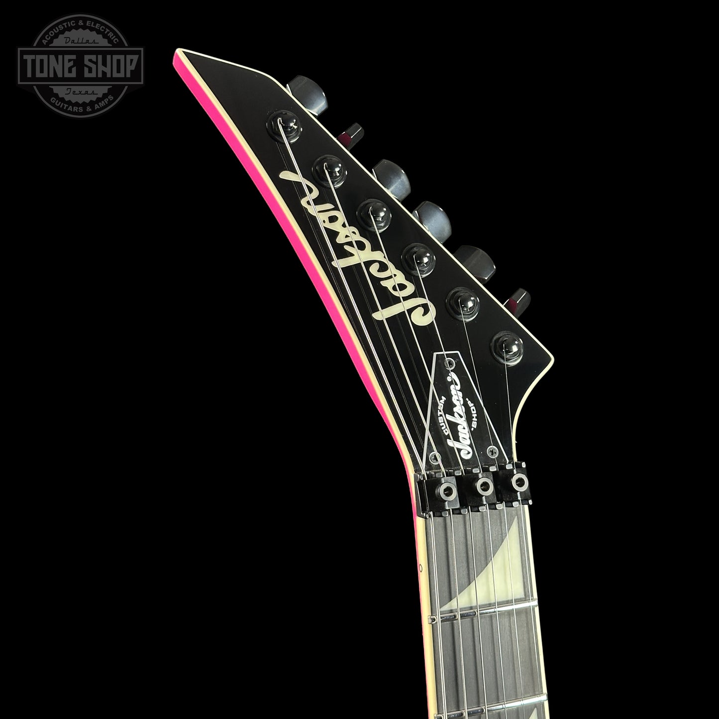 Front left angle of Jackson Custom Shop TSG Illuminati SL2H FR  Neon Pink J11328.