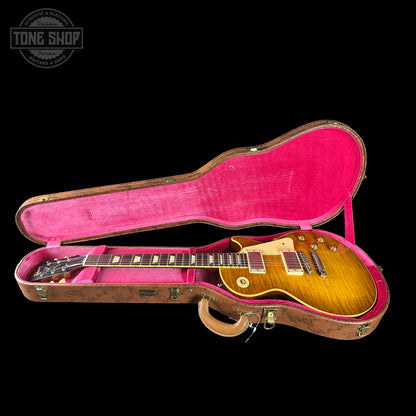 Gibson Les Paul guitar in a pink-lined case with 'Tone Shop' logo.