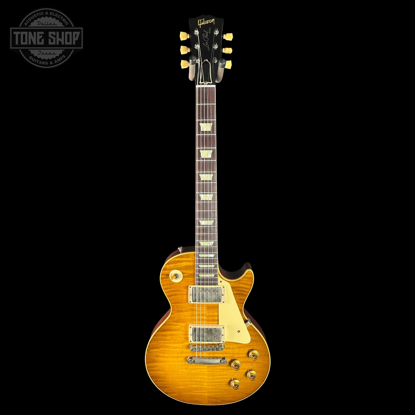 Gibson Les Paul electric guitar with a sunburst finish on a black background, featuring the Tone Shop logo.