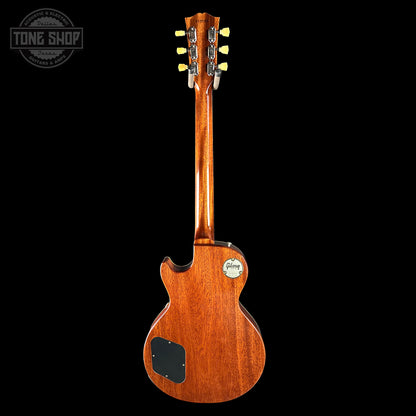 Wooden electric guitar on a black background with 'Tone Shop' logo.