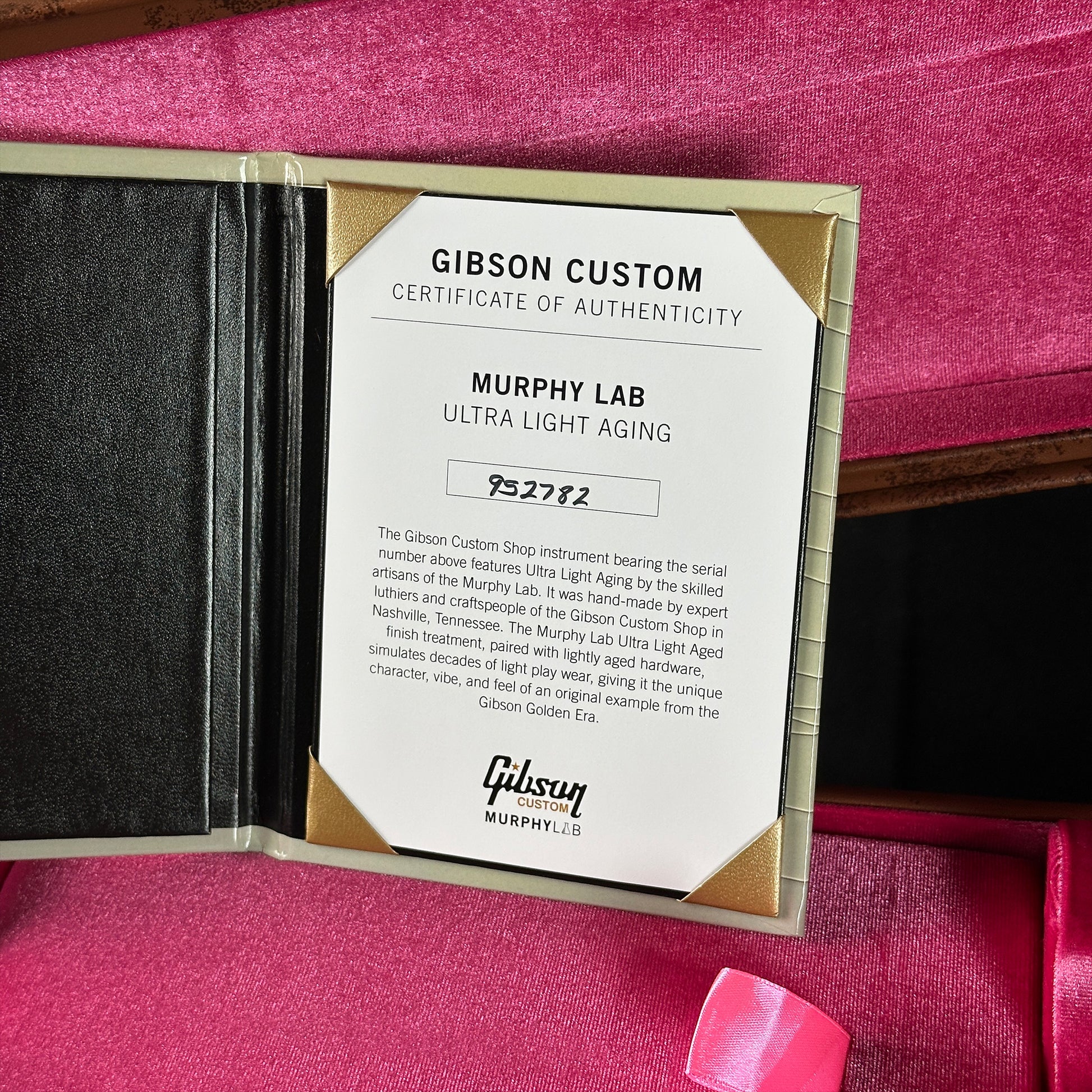Gibson Custom Certificate of Authenticity for Murphy Lab Ultra Light Aging on a pink background