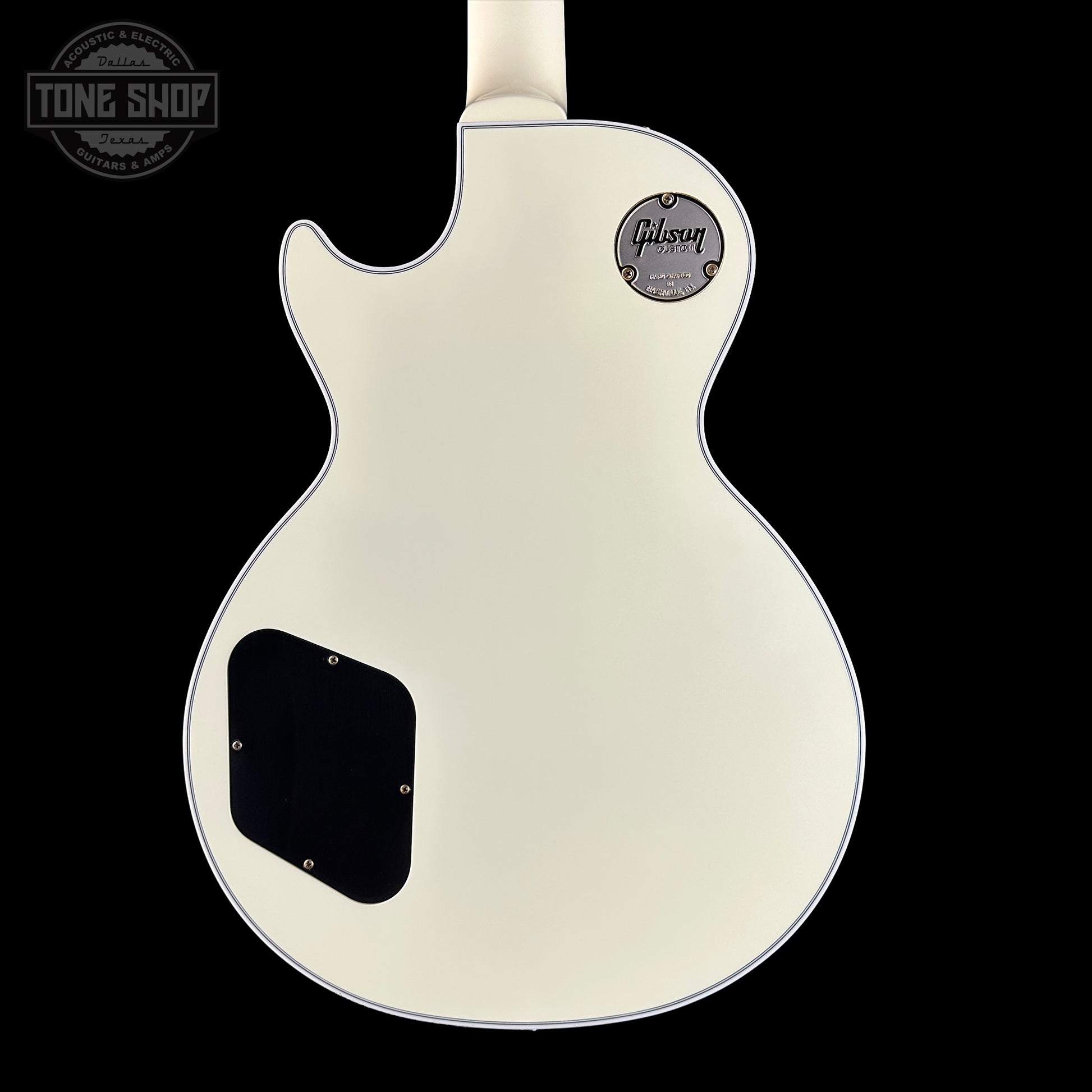 Gibson Les Paul electric guitar body on a black background with 'Tone Shop' logo.