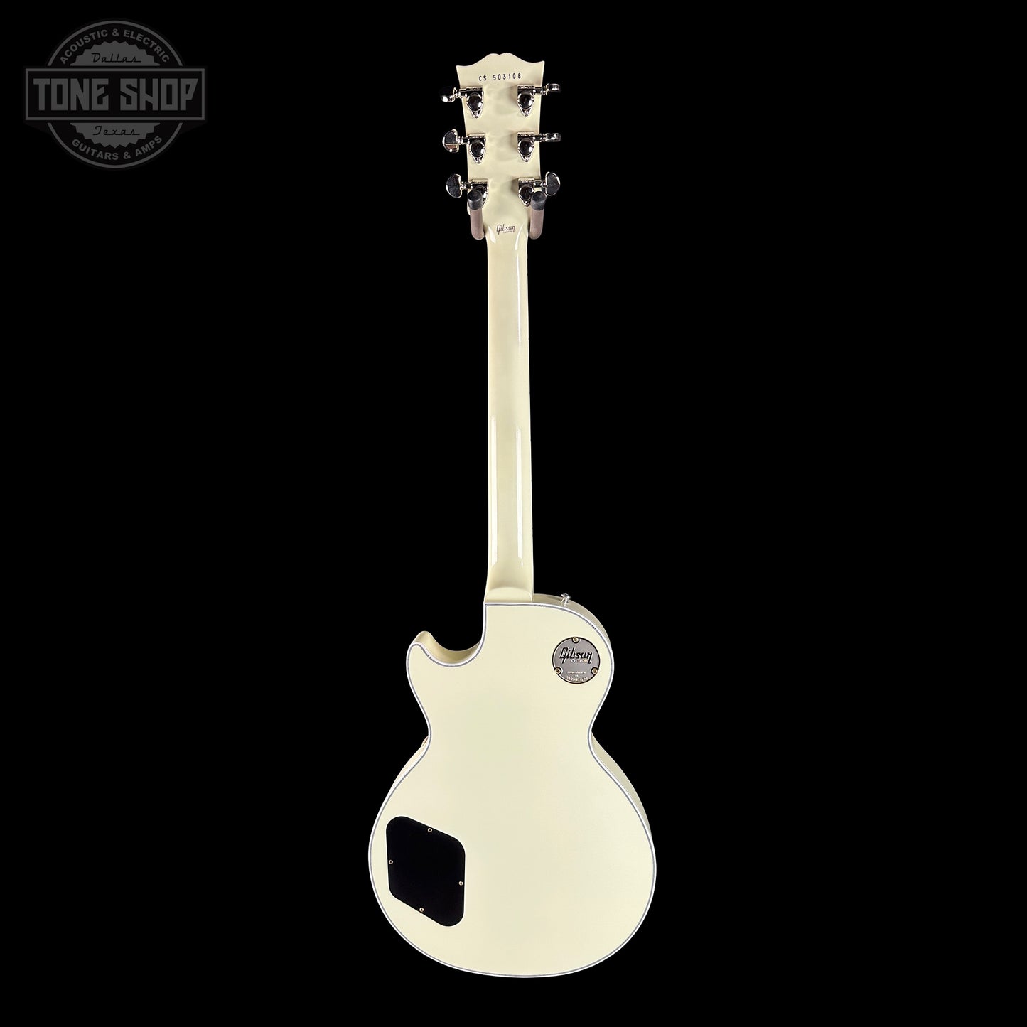 White electric guitar on a black background with 'Tone Shop' logo.