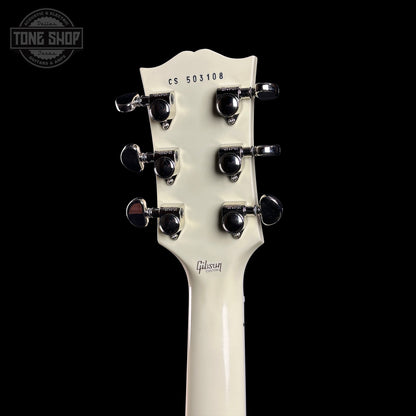 Gibson guitar headstock with brand logo on a black background