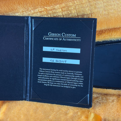 Gibson Custom Certificate of Authenticity on a wooden surface