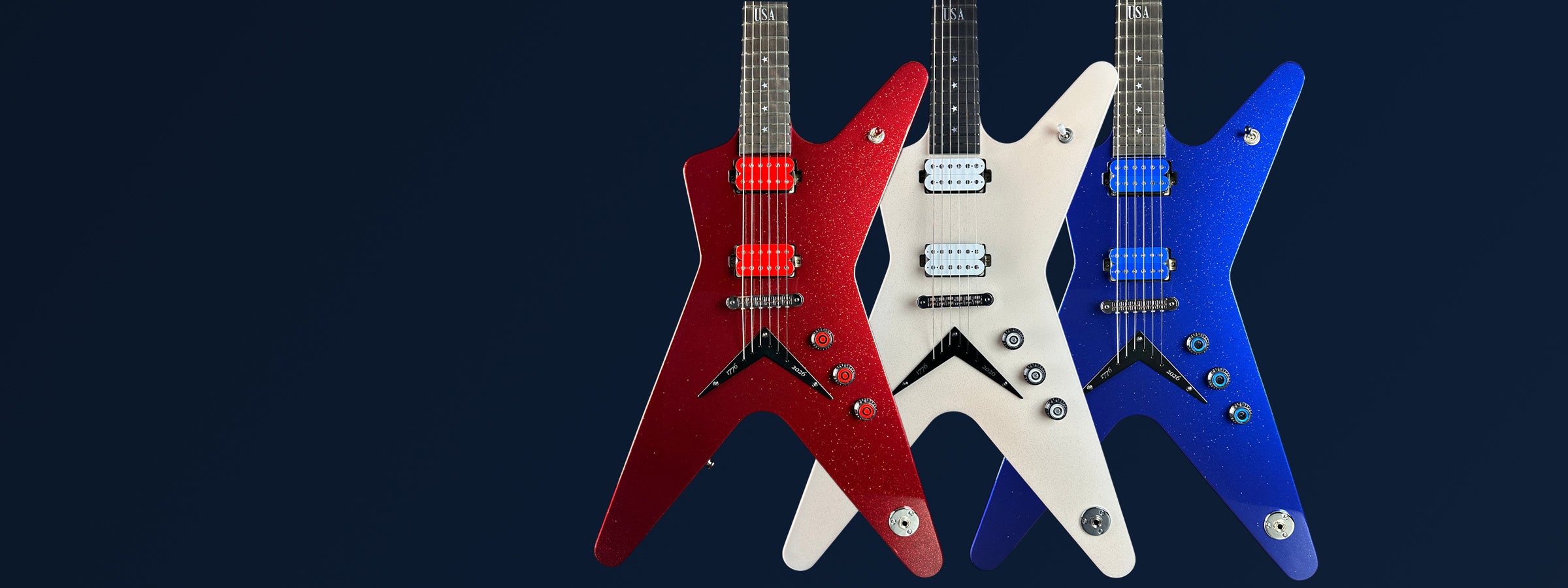A group of three guitars, one red, one white, one blue, against a blue background with "labor day sale" text above.