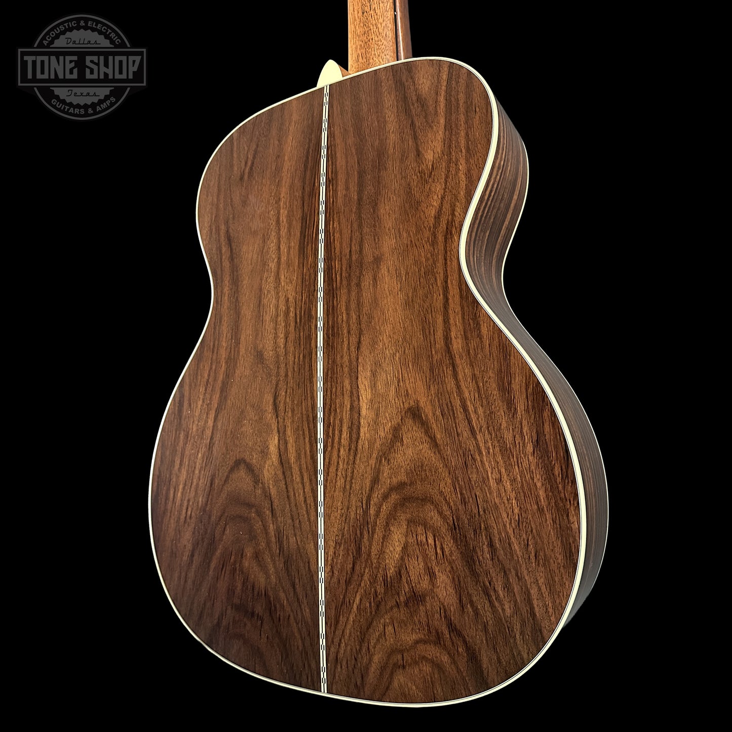 Back right angle shot of Martin Custom Shop 000 14-Fret Wild Grain East Indian Rosewood body.