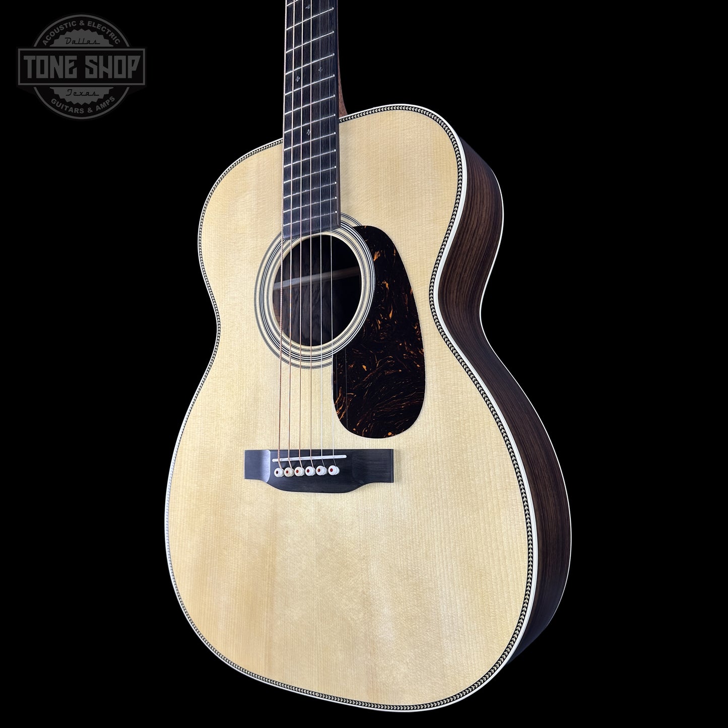 Front right angle of Martin Custom Shop 00 14-Fret Wild Grain East Indian Rosewood.