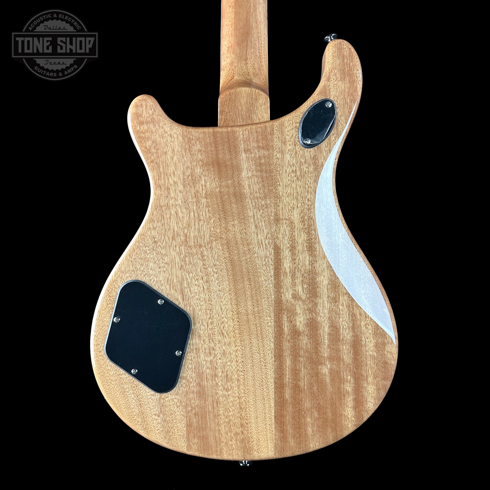 Wooden guitar body with a visible brand logo in the corner