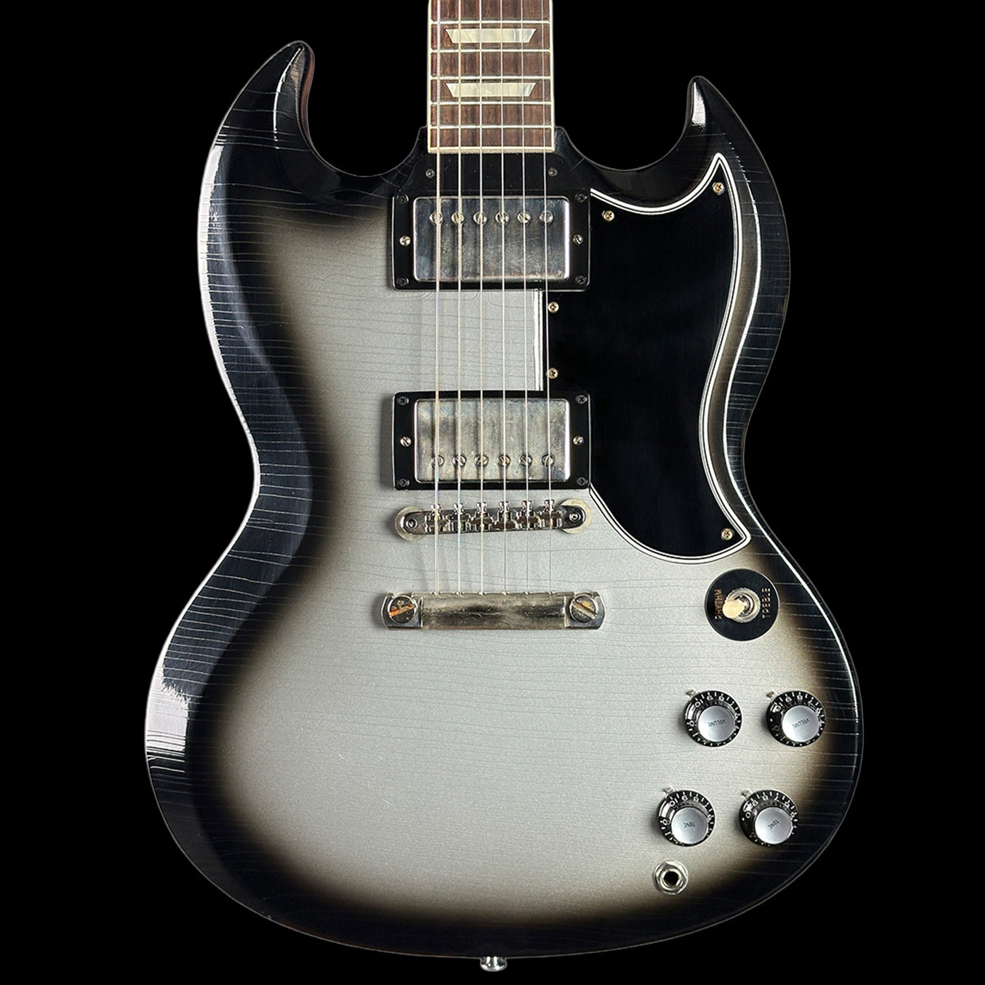 Electric guitar with a black and silver design on a black background