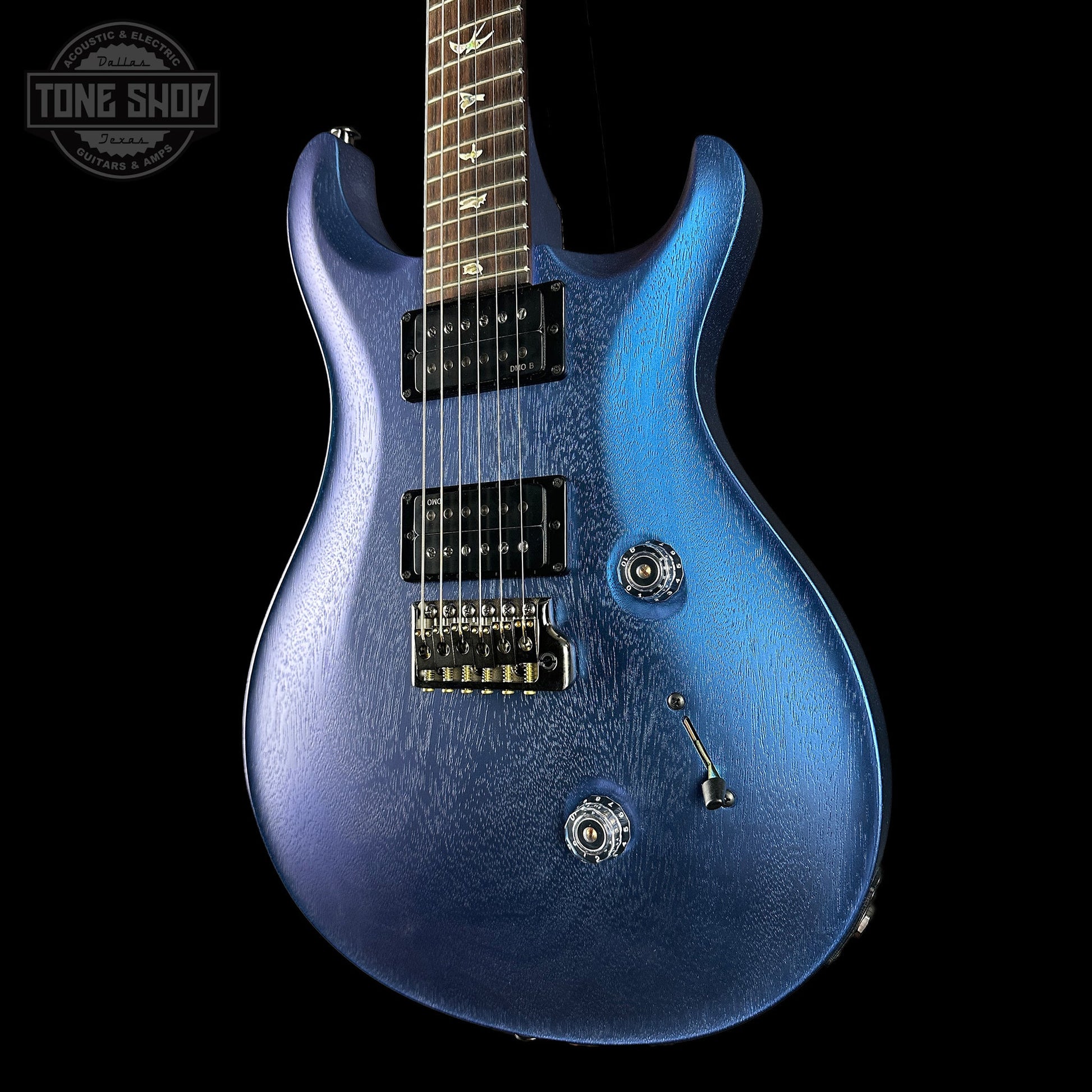 Angled shot of blue PRS Standard 24 Satin Pearl Black w/case
