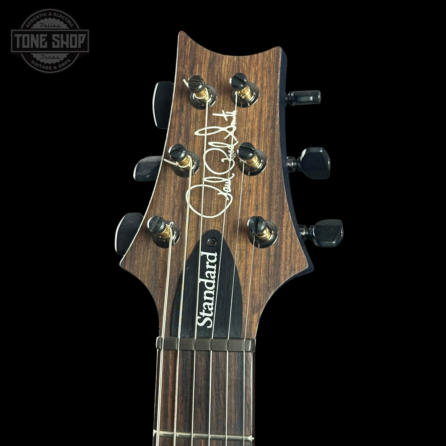 Guitar headstock with 'Standard' label on a black background, featuring the Tone Shop logo.