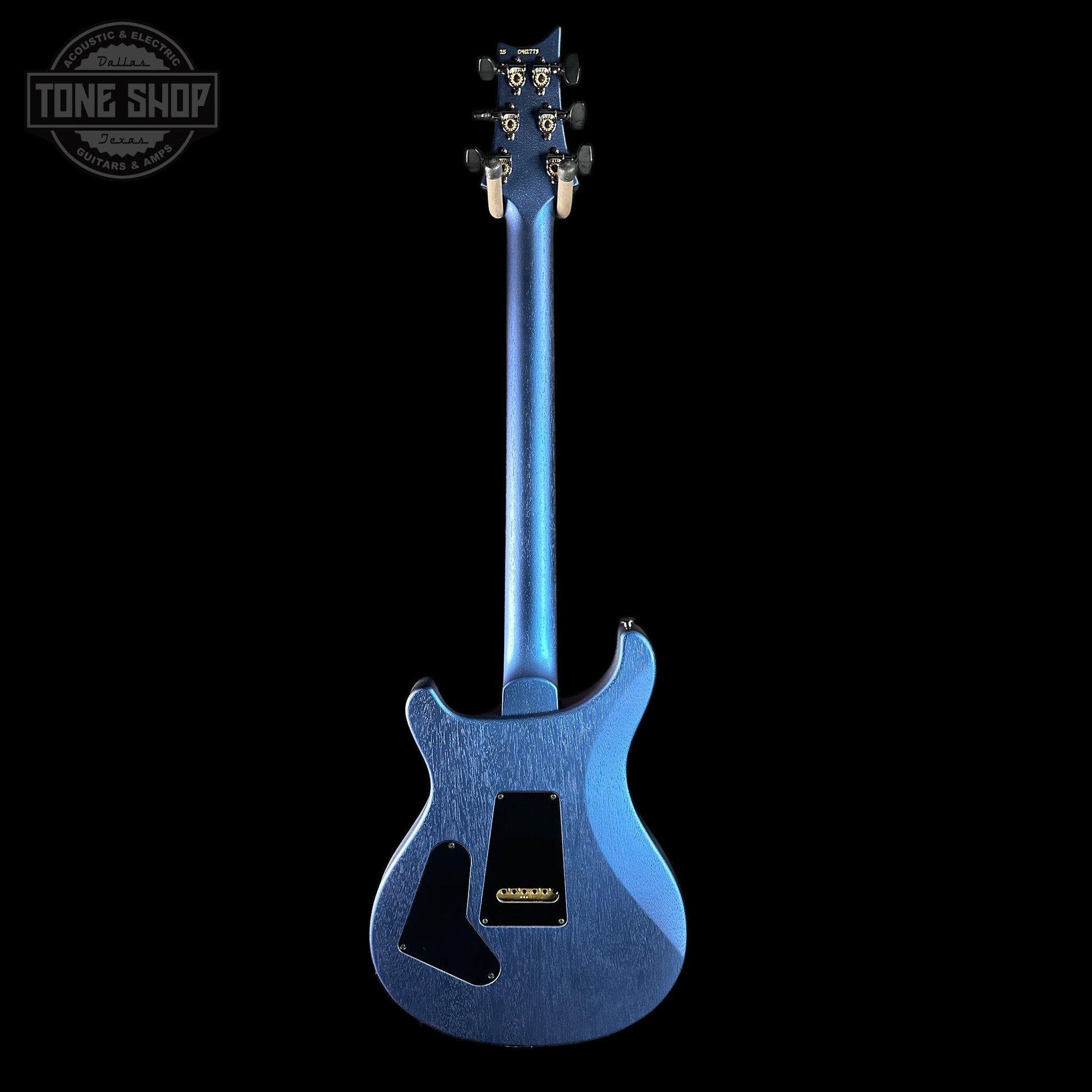 Blue electric guitar on a black background with 'Tone Shop' logo.