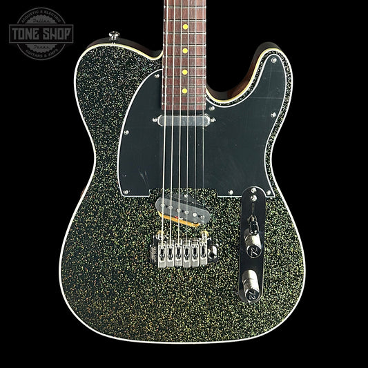 Green glittery electric guitar on a black background with 'Tone Shop' logo.