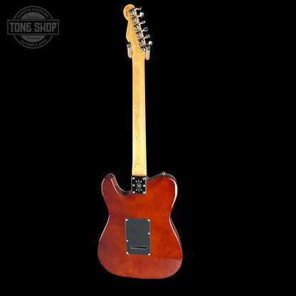 Electric guitar with a brown finish on a black background, featuring the Tone Shop logo.