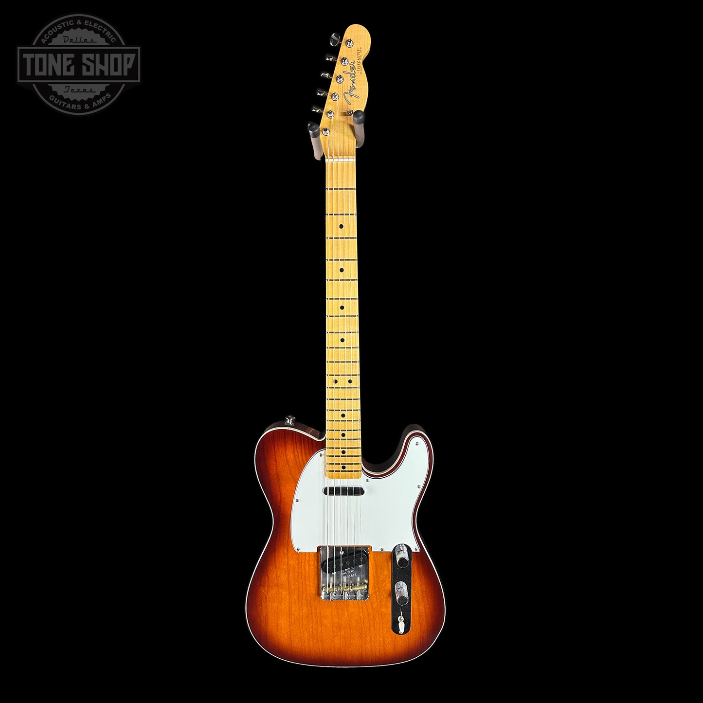 Electric guitar with a sunburst finish on a black background, featuring the Tone Shop logo.