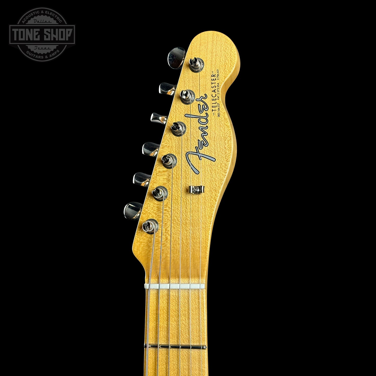 Fender Telecaster guitar headstock on a black background