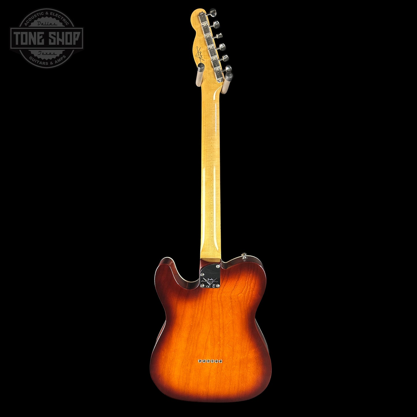 Electric guitar with a sunburst finish on a black background, featuring the Tone Shop logo.