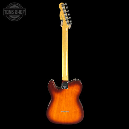 Electric guitar with a sunburst finish on a black background, featuring the Tone Shop logo.