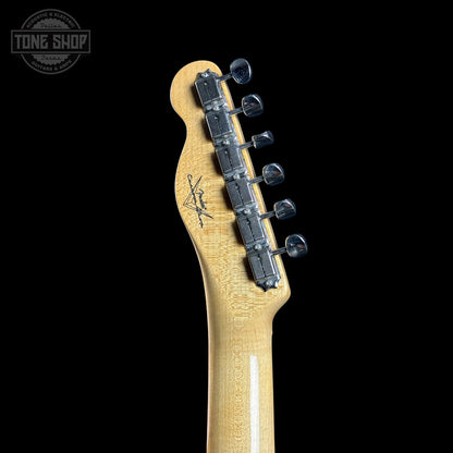Guitar headstock with tuning pegs on a black background, featuring the Tone Shop logo.