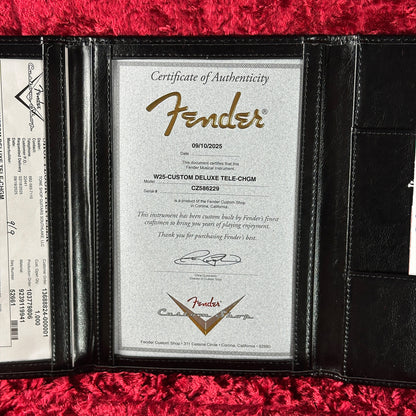 Fender Certificate of Authenticity in a black leather case on a red background