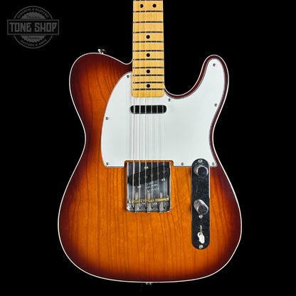 Electric guitar with a sunburst finish on a black background, featuring the Tone Shop logo.