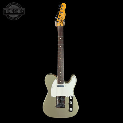 Electric guitar with a white pickguard on a black background, featuring the Tone Shop logo.