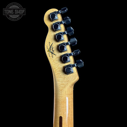 Guitar headstock with tuning pegs on a black background, featuring the Tone Shop logo.