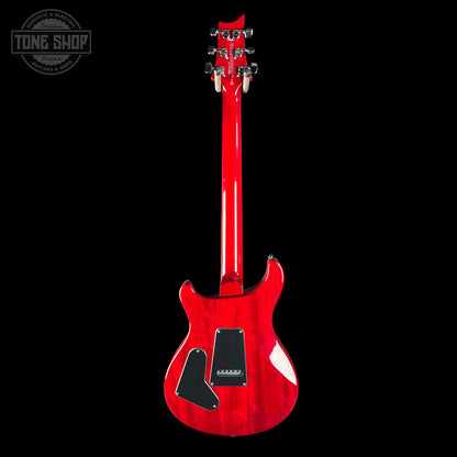 Red electric guitar on a black background with 'Tone Shop' logo.