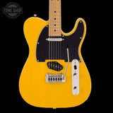 Yellow electric guitar with a black pickguard on a black background, featuring 'Tone Shop' branding.
