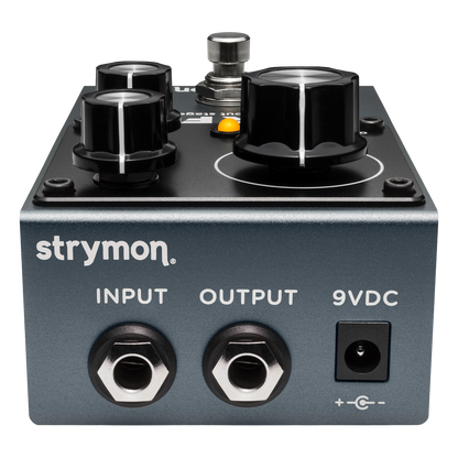 Strymon guitar effects pedal with input, output, and 9VDC connectors on a white background
