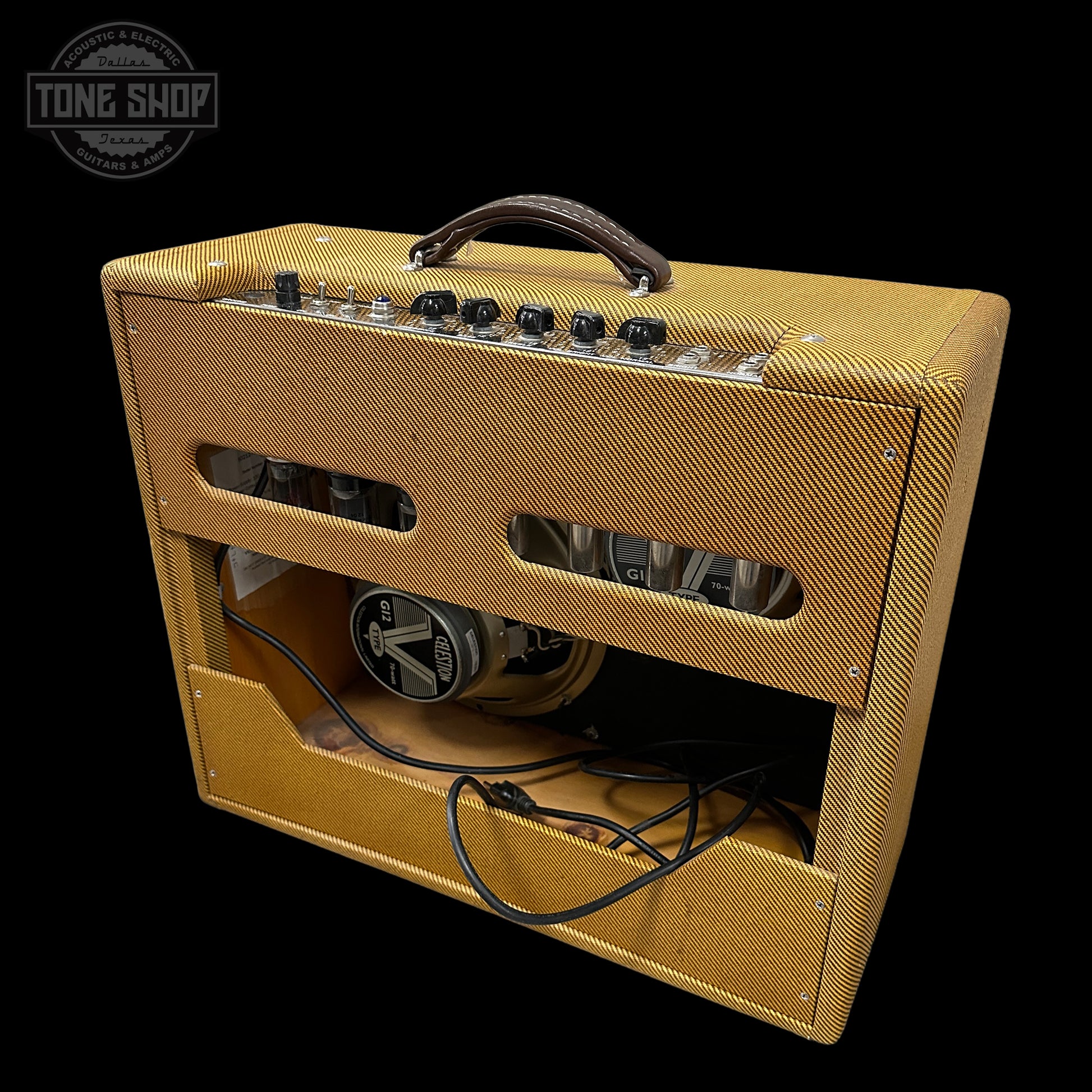 Vintage-style guitar amplifier with a 'Tone Shop' logo in the corner.