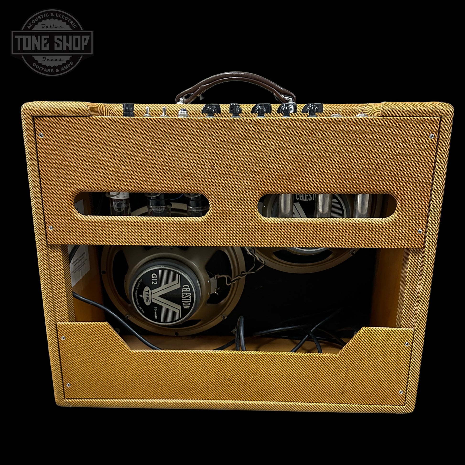 Yellow guitar amplifier with visible brand logo on a black background