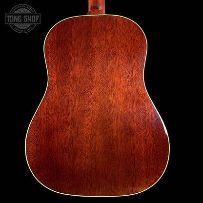 Back view of a wooden acoustic guitar with 'Tone Shop' logo in the corner.