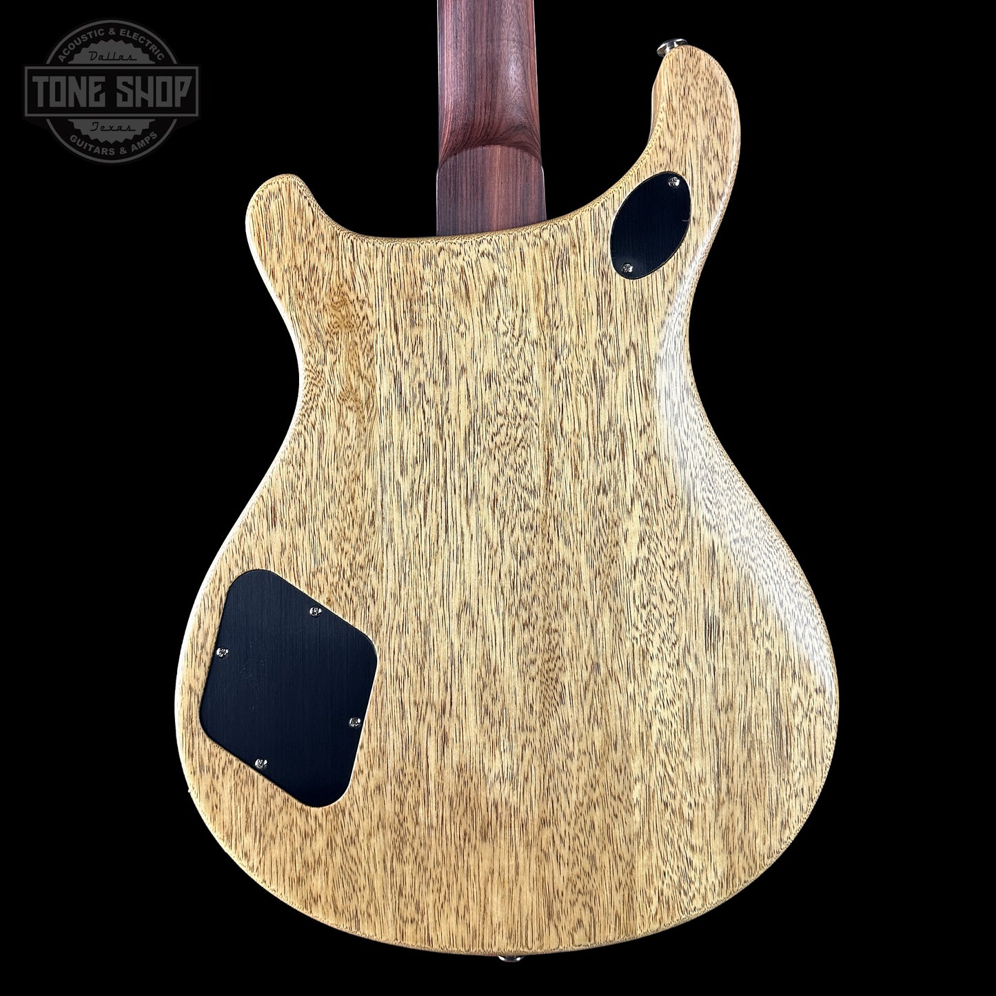 Back of a guitar with a wood finish  