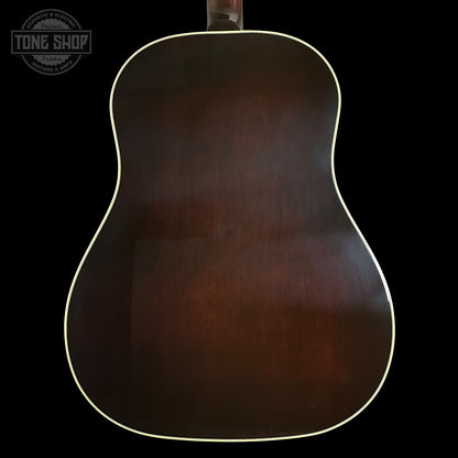 Back of a guitar with a dark brown finish on a black background, featuring the Tone Shop logo.