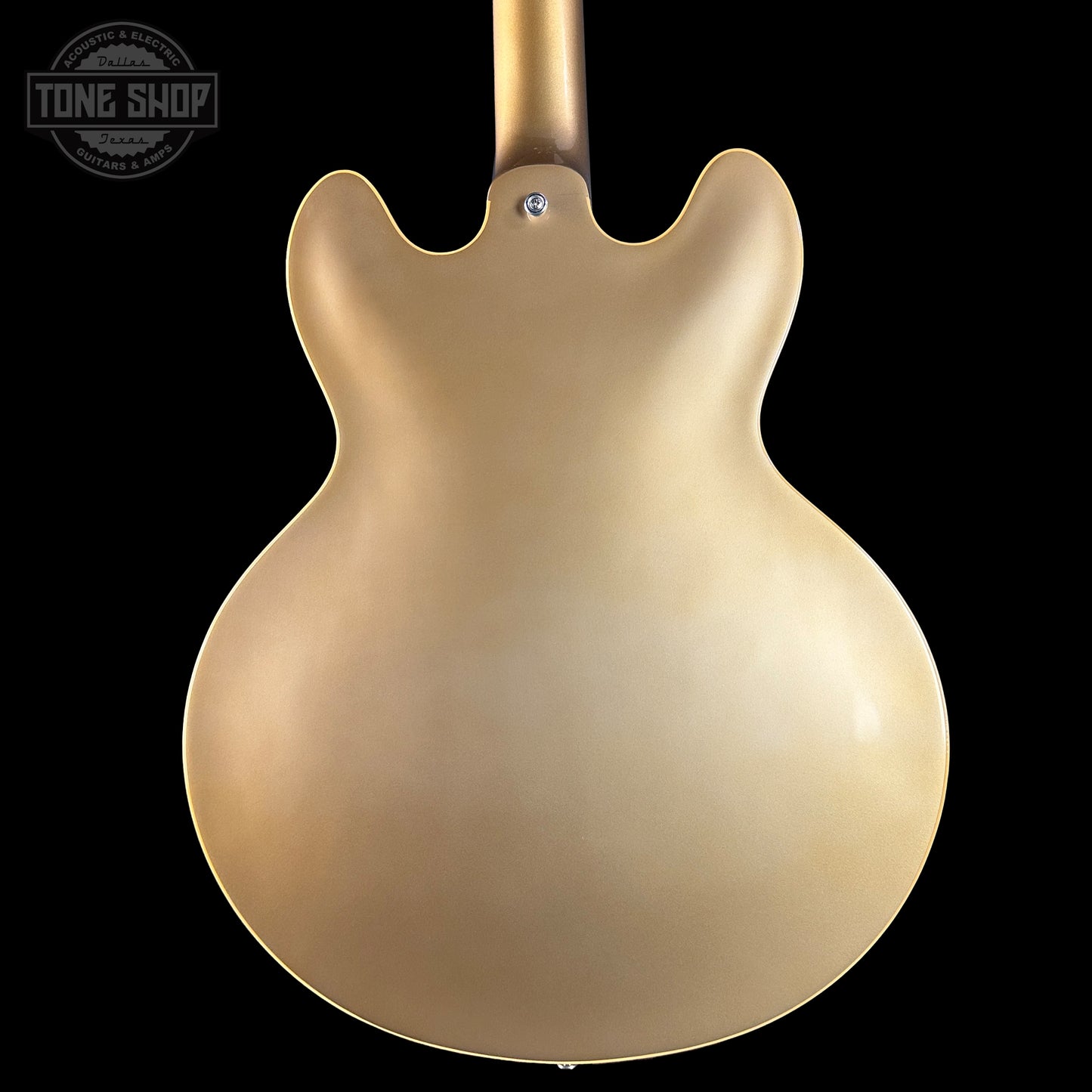 Gold electric guitar body on a black background with 'Tone Shop' logo.