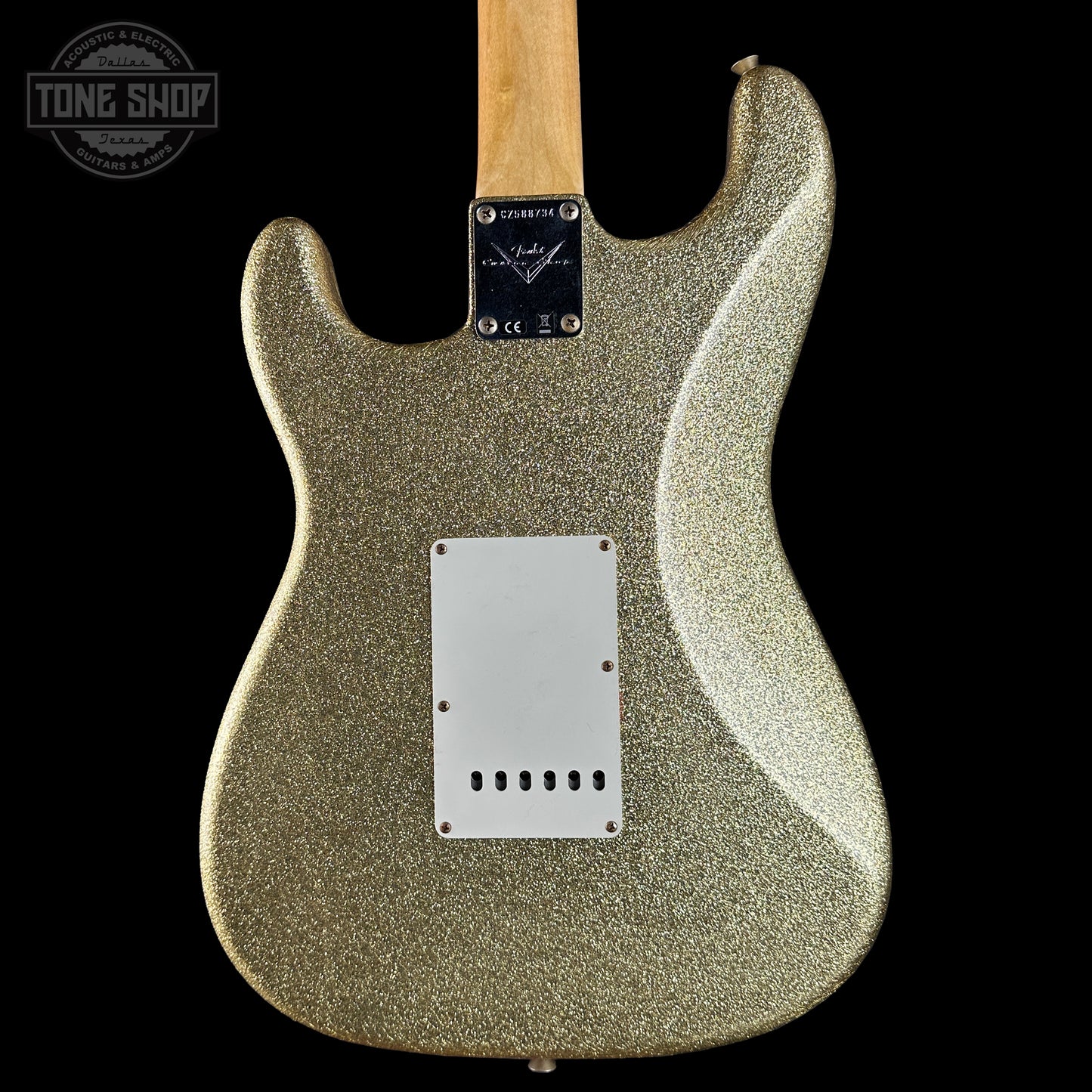 Guitar body with glittery finish on a black background