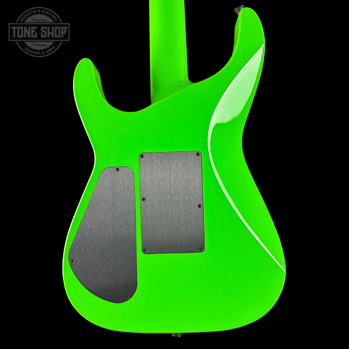 Green electric guitar body with black pickguard on a black background, featuring 'Tone Shop' logo.