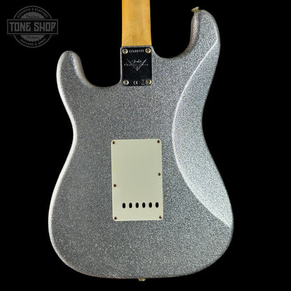 Silver glitter electric guitar with a black background