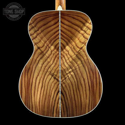 Wooden guitar back with 'Tone Shop' logo in the corner