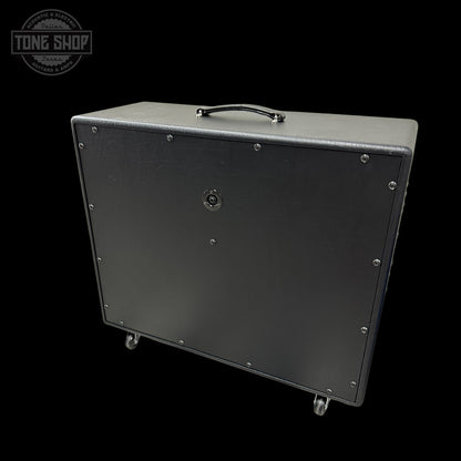 Guitar amplifier cabinet with 'Tone Shop' logo in the corner